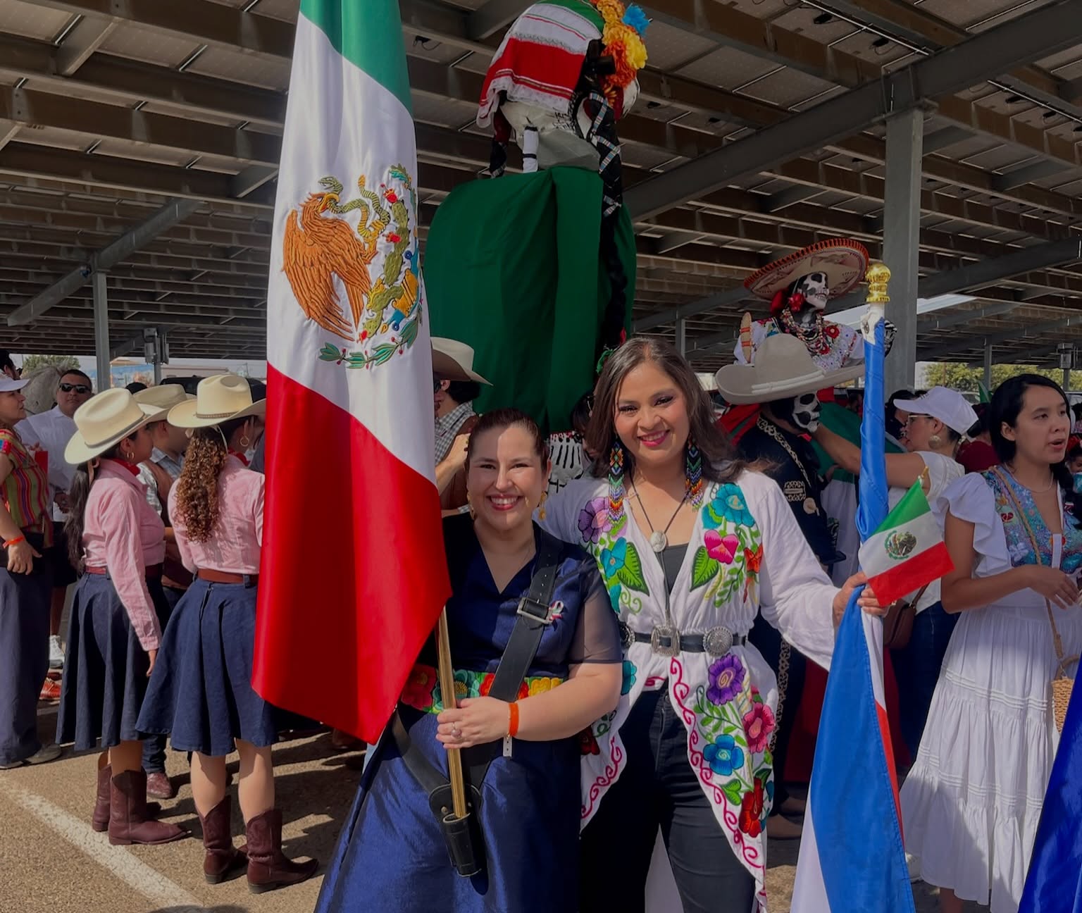 Maria Pacheco celebrating with community members at a local festival